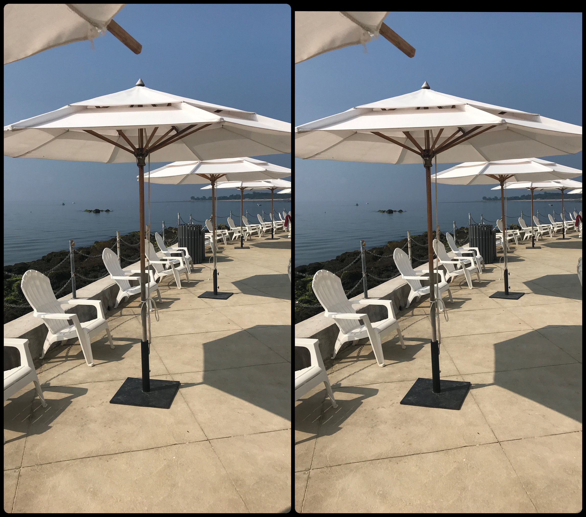 Umbrellas by the water, stereo pair